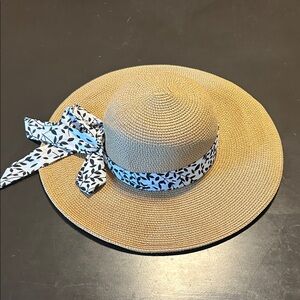 Elegant Tan Sun Hat with Black and White Ribbon